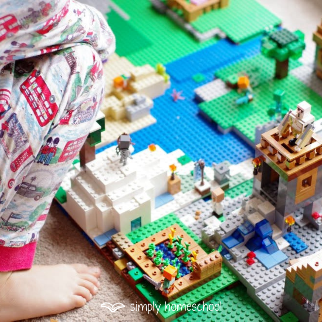 Child in pyjamas building Lego. Homeschool support and encouragement from Simply Homeschool. Australia's best homeschool curriculum provider of unit studies based on quality books. Family style learning